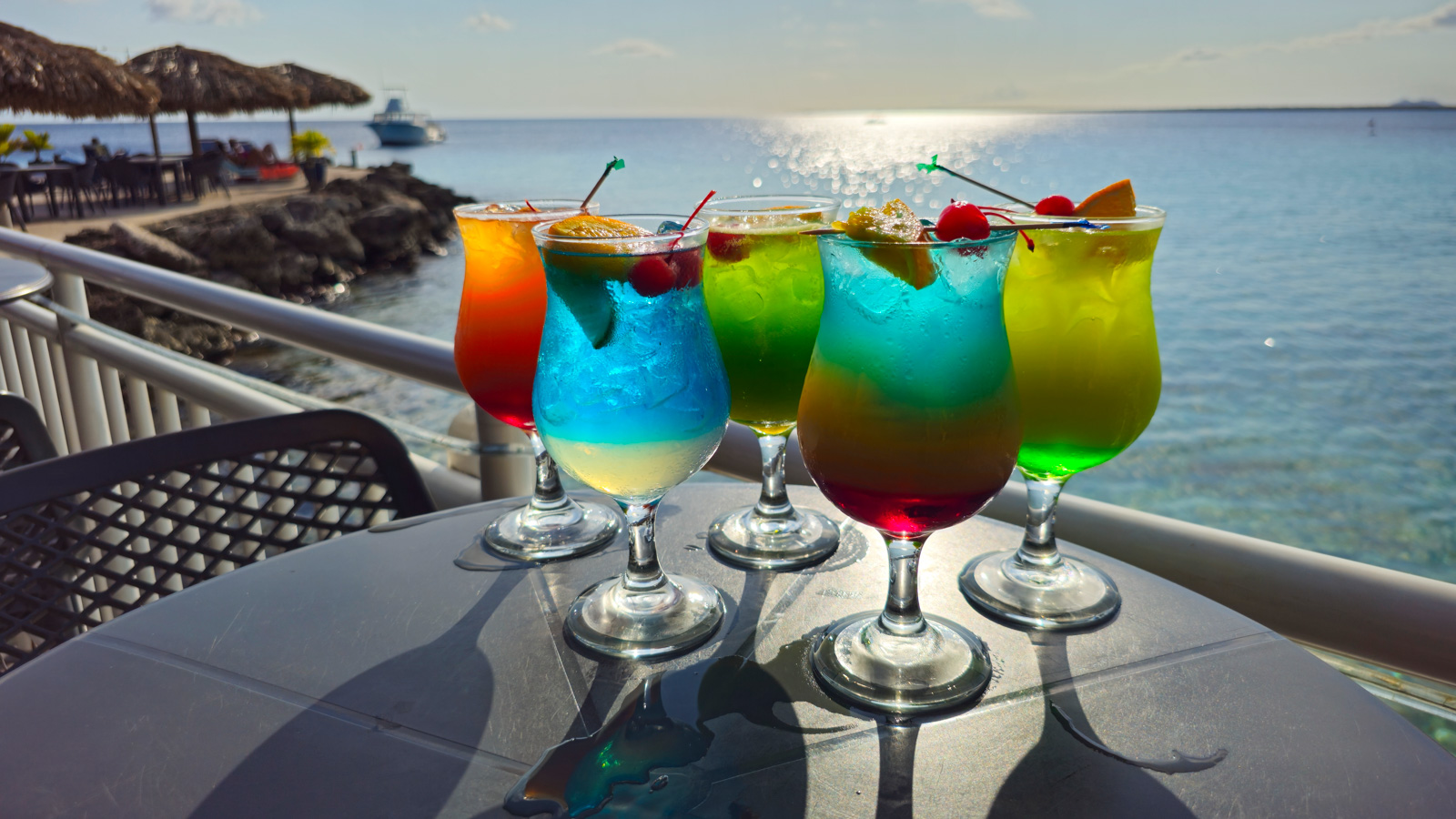 a group of colorful drinks on a table