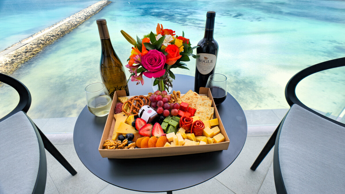 a box of food and wine on a table